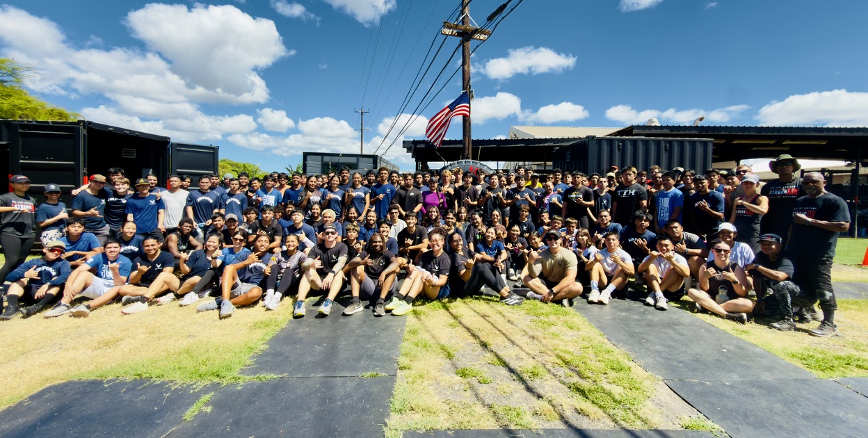 Large group photo of military recruits and BTB coaches at the Ewa Beach training facility